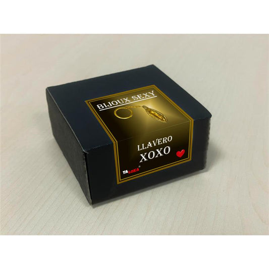 Chaveiro dourado em formato de vagina